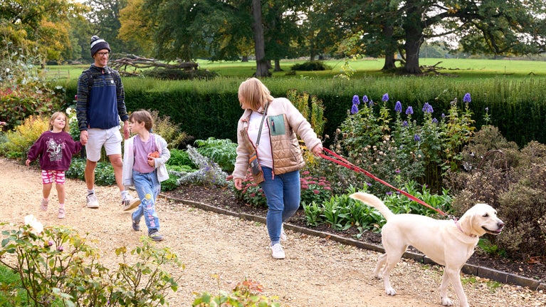 A family explores the gardens at The Vyne.